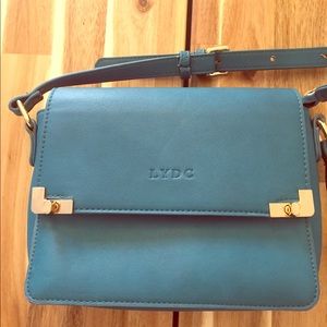Cute teal crossbody bag.